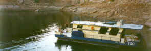 Houseboat stopped for the night in a cove on the San Juan River.