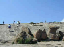 Many hikers heading to the top of Enchanted Rock