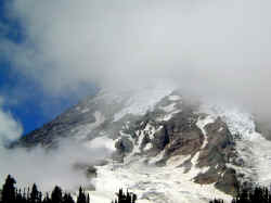 Mount Rainier shrouded in clouds.